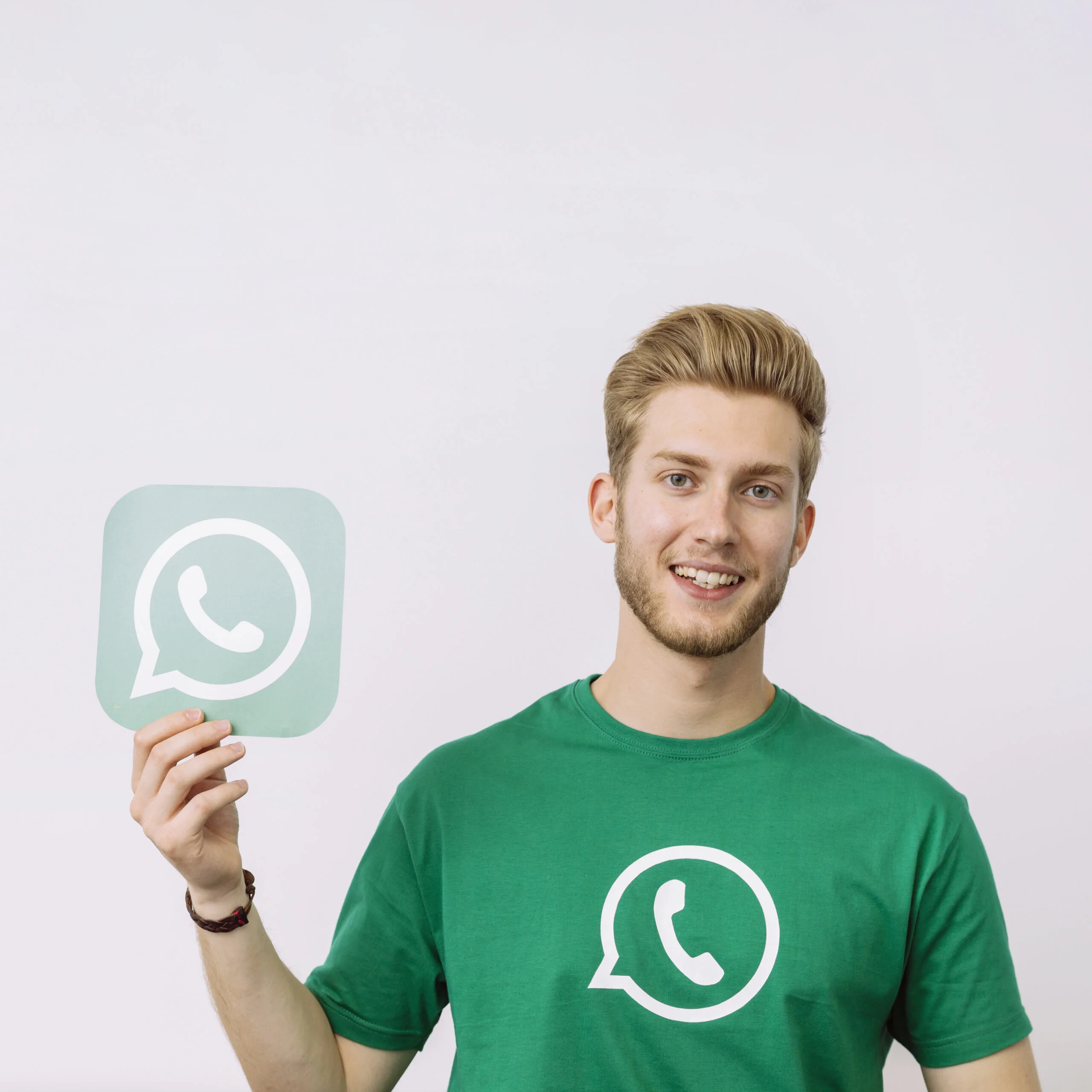 young-man-holding-whatsup-icon-against-white-background-scaled